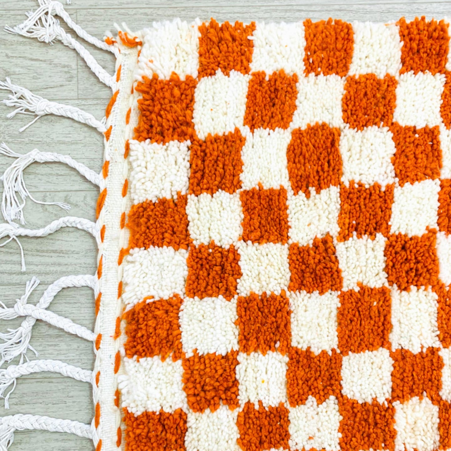 TASSELS-OF-CHECKERED-ORANGE-RED-MOROCCAN-RUG