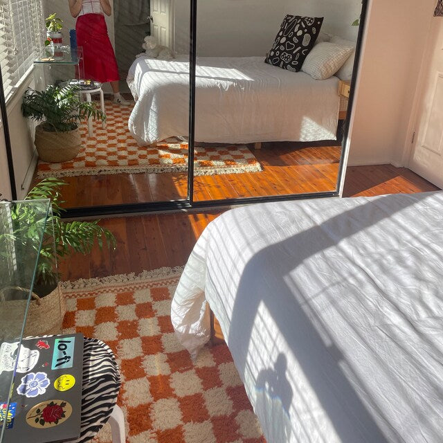 orange-and-white-checkered-moroccan-rug-bedroom