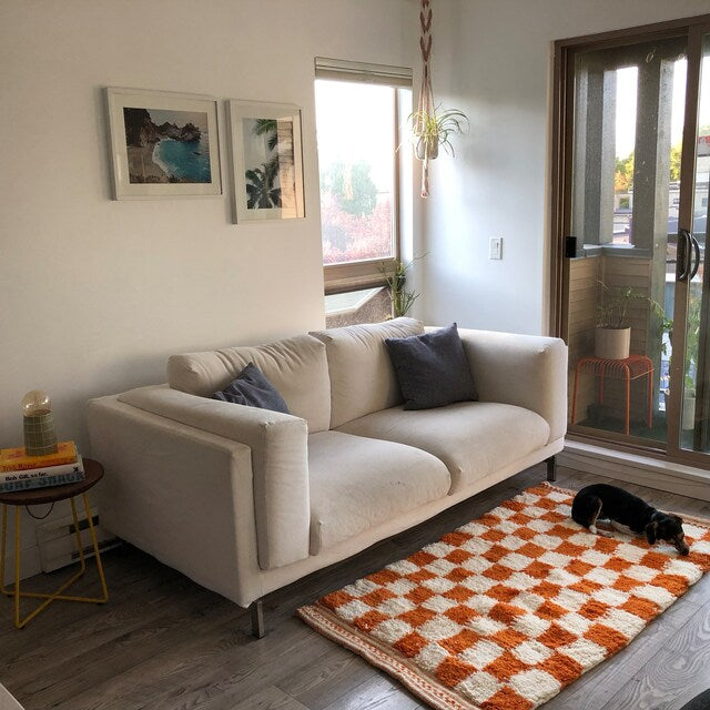 small-orange-moroccan-checkered-rug-under-couch-in-usa-california-los-angeles